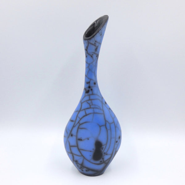 Raku fired narrow necked vase in electric blue by artist Helen Rondell
