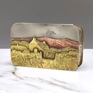 Metal hinged box depicting birds flying over a farmhouse in the heat of the summer by artist Cornelius Van Dop