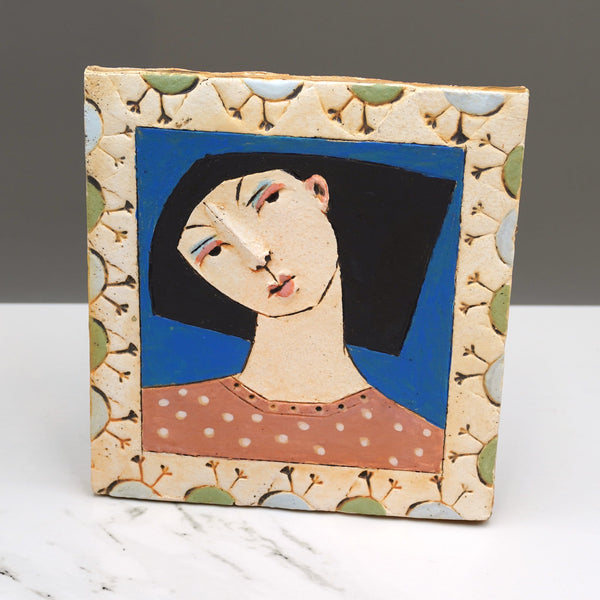 Ceramic portrait tile by artist Christy Keeney