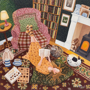 Painting of a lady relaxing in front of the fireplace, with chocolates, a good book and pets by her side by artist Lucy Almey Bird