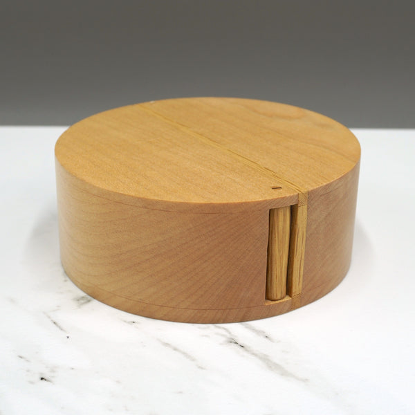 An sycamore and oak circular hinged box made by Steve Parkinson