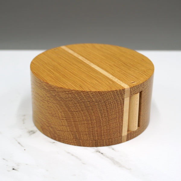 An oak and sycamore circular hinged box made by Steve Parkinson