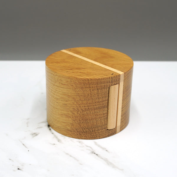 An oak and sycamore circular hinged box made by Steve Parkinson