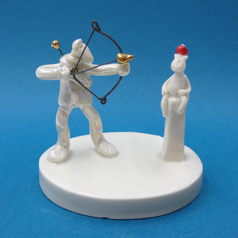 Porcelain sculpture of an archer and his brave cat by artist Andrew Bull