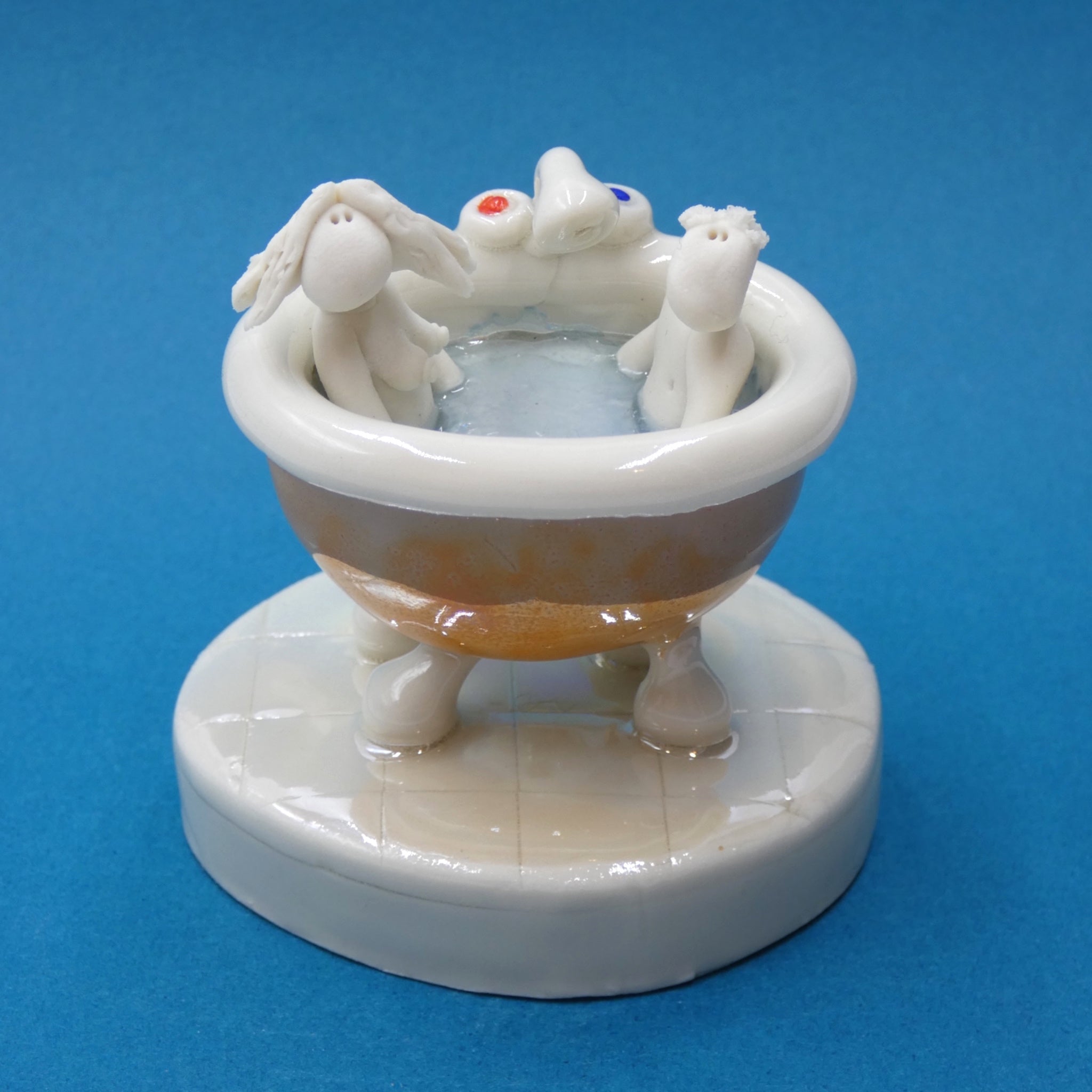 Porcelain sculpture of a couple in the bath by artist Andrew Bull
