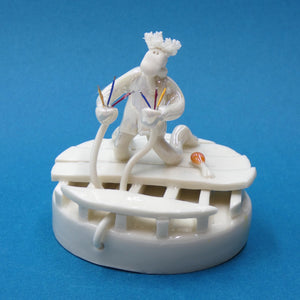 Porcelain sculpture of an electrician with zapped hair by artist Andrew Bull