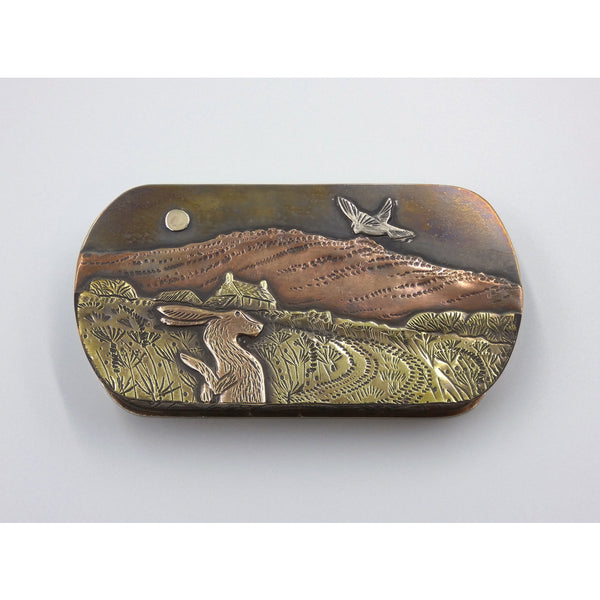 Metal hinged box depicting an owl and a hare under the moon on a warm summer night by artist Cornelius Van Dop
