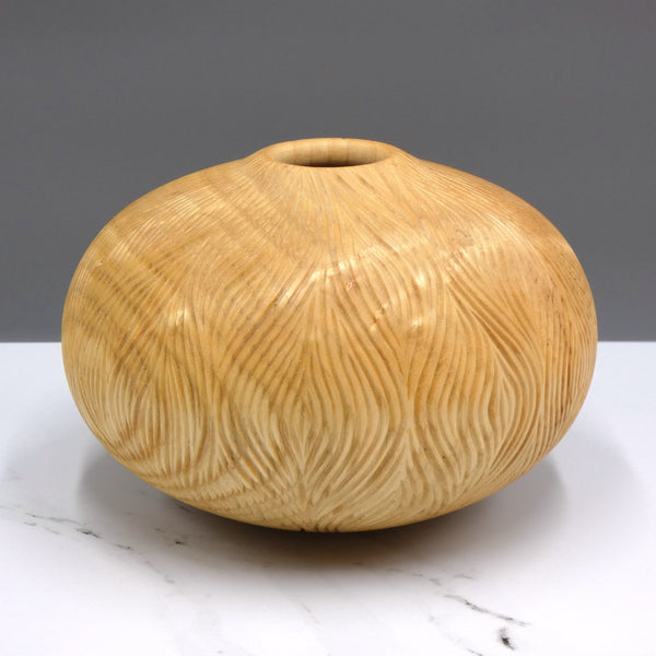 Carved ash vase by woodturner Howard Moody