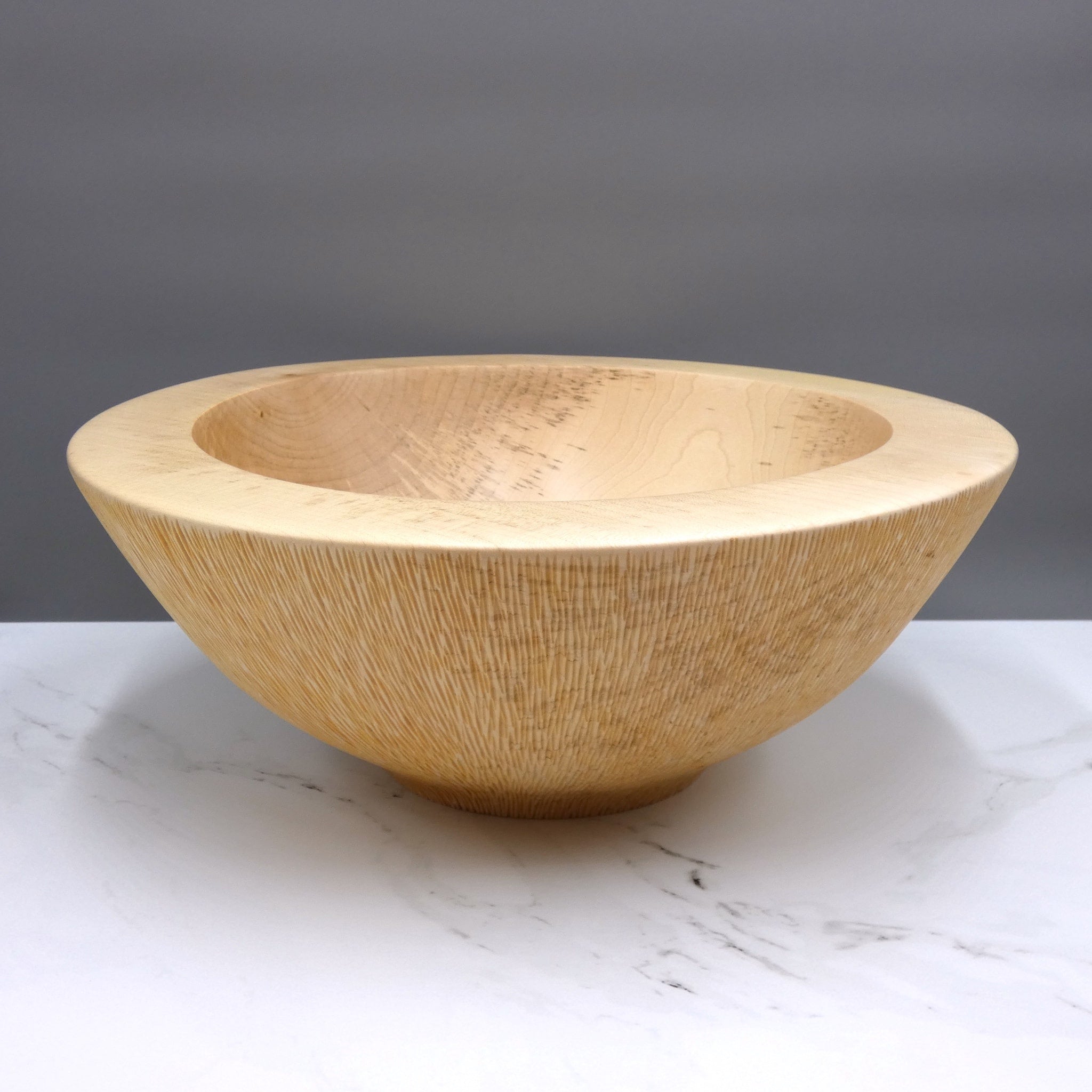 Carved sycamore bowl by woodturner Howard Moody