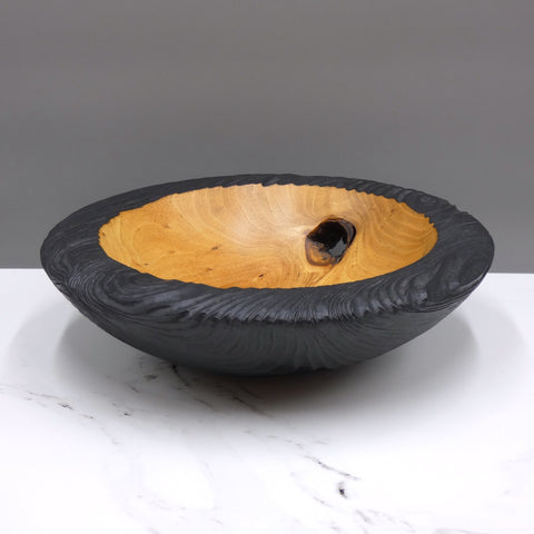 Carved and scorched elm bowl by woodturner Howard Moody