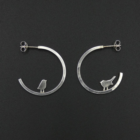 Mismatched bird hoop studs by jeweller Helen Shere