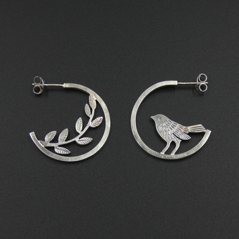 Mismatched bird and leaves hoop stud earrings by jeweller Helen Shere