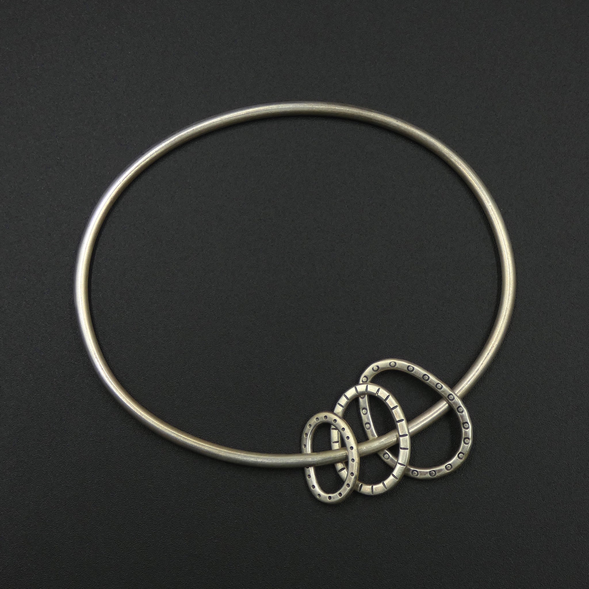 Oval bangle with three hoops by jeweller Helen Shere