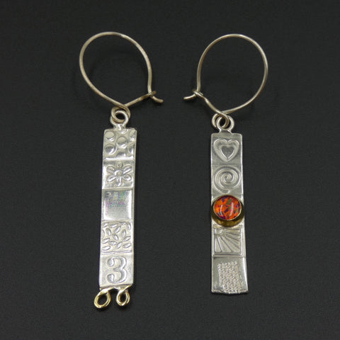 Asymmetric earrings by jewellers John and Dawn Field