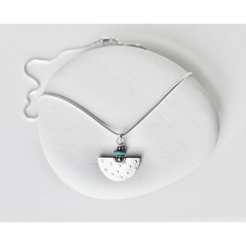 Sterling silver amulet pendant with turquoise bead by jeweller Kathleen Appleyard