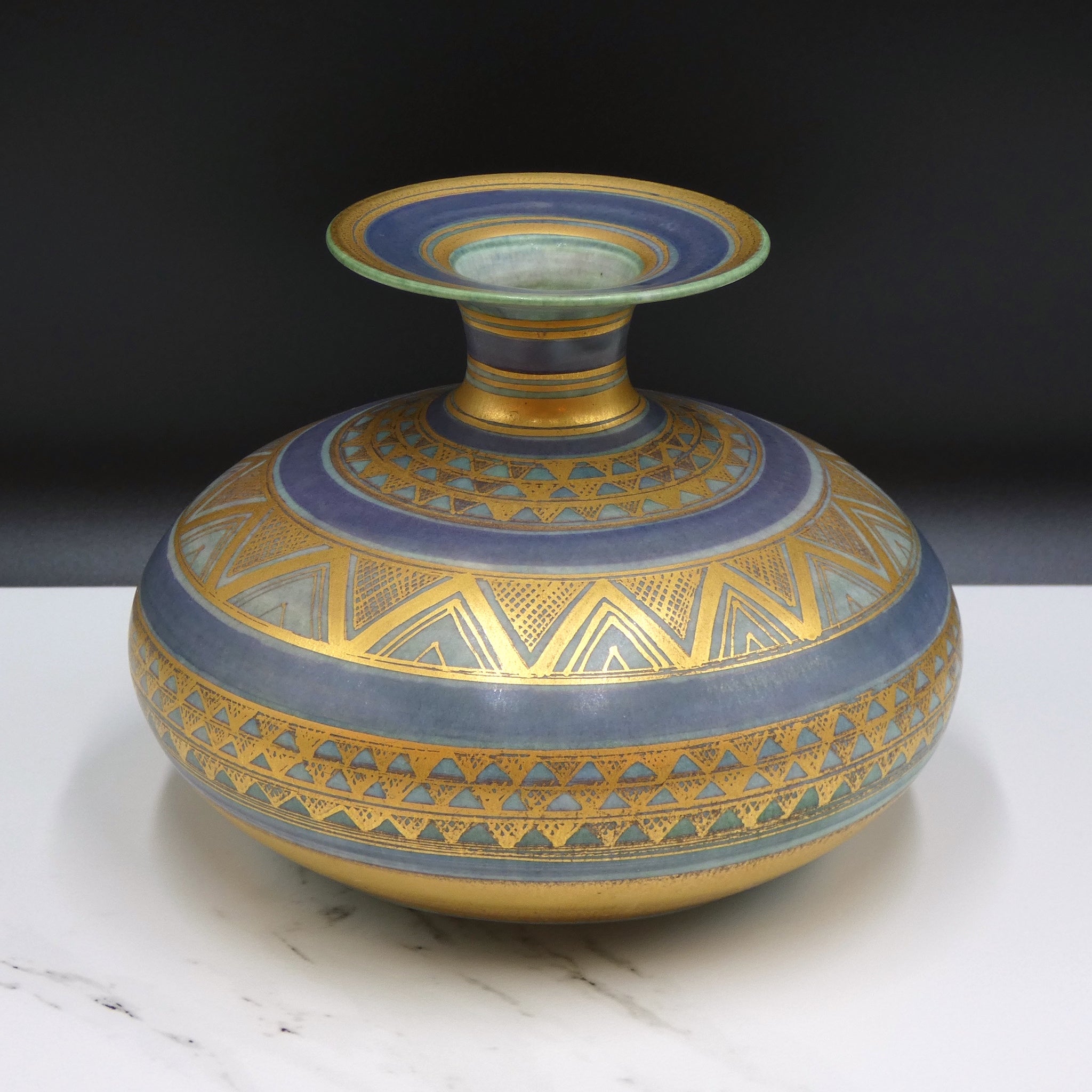 Wheel thrown porcelain with gold lustre by potter Mary Rich